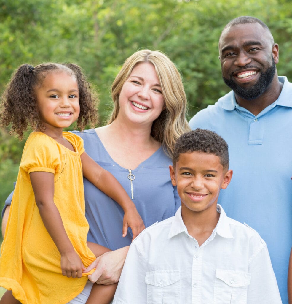 Portrait of a happy mixed race family smiling Penn Foundation